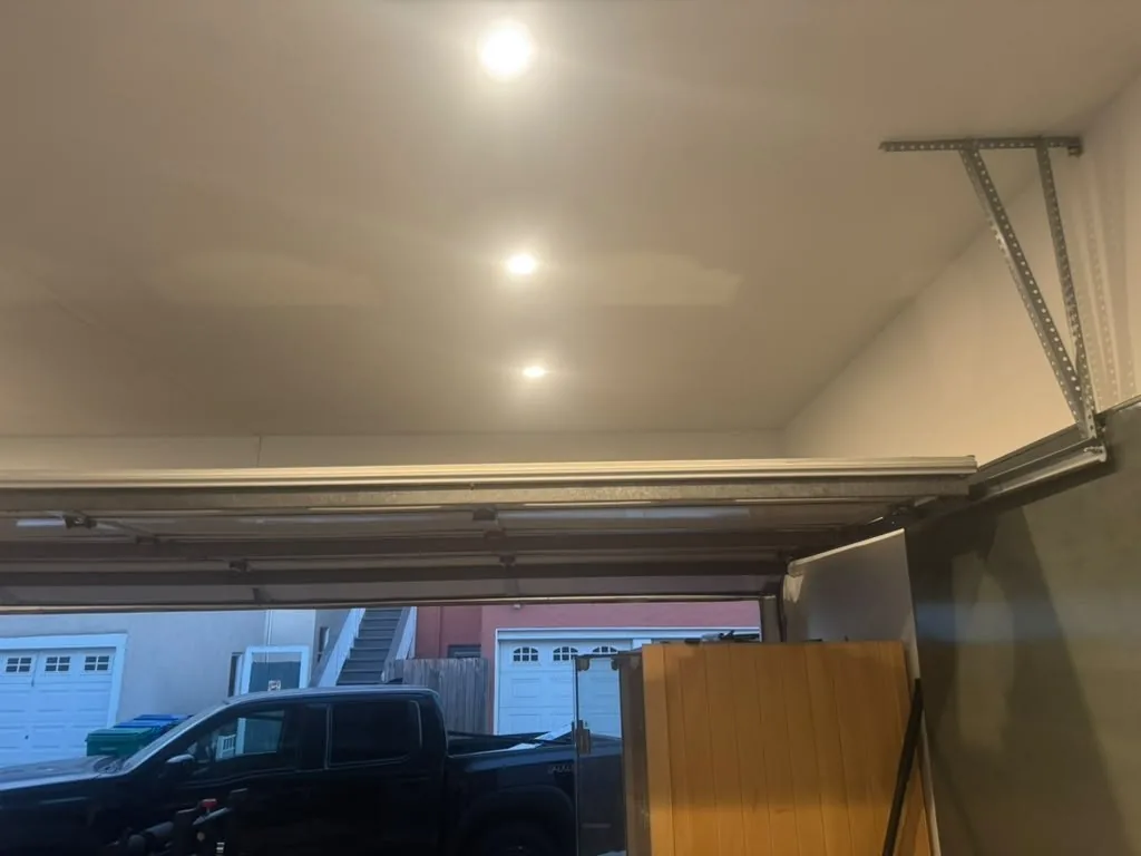 Clear garage ceiling above an open sectional door in Encino